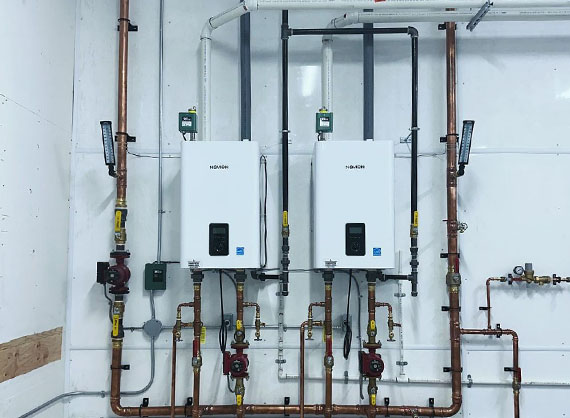 Newly installed Navien high-efficiency boiler system with copper plumbing.